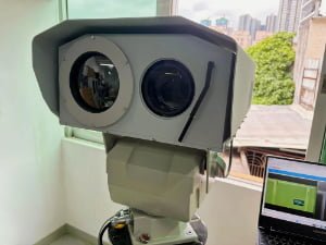 Heavy-duty pan-tilt head supporting a multi-sensor surveillance payload