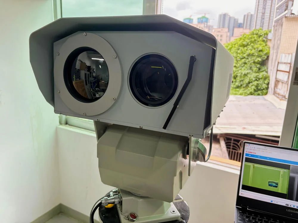Heavy-duty pan-tilt head supporting a multi-sensor surveillance payload